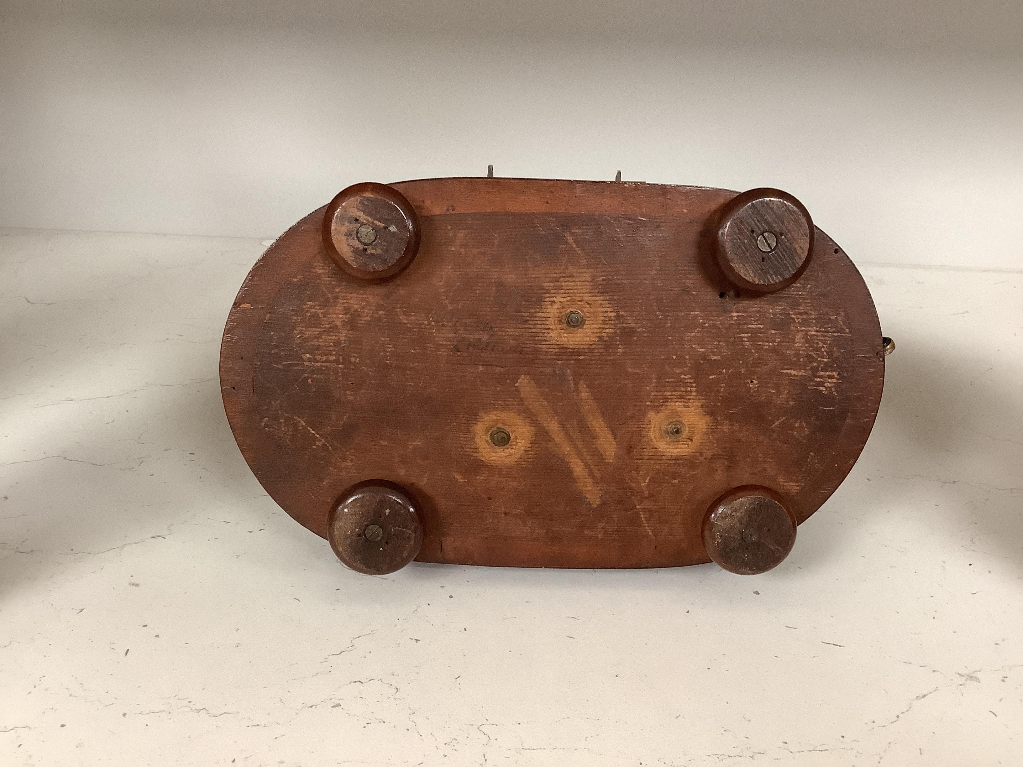 A 19th century French musical mantel timepiece, the dial inscribed Albert A Paris, the mahogany base with music box movement, 29cm high